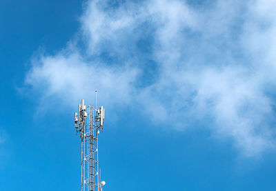 Low angle view of communications tower against sky