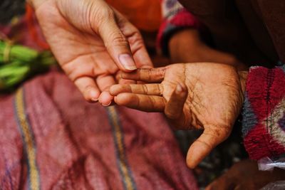 Close-up of woman holding hands