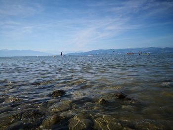 Scenic view of sea against blue sky