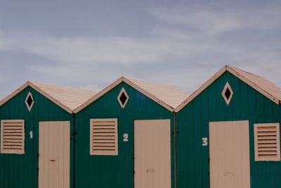 Beach huts against sky