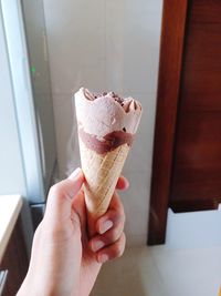 Cropped hand of person holding ice cream