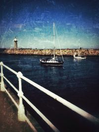 Boats in sea against sky