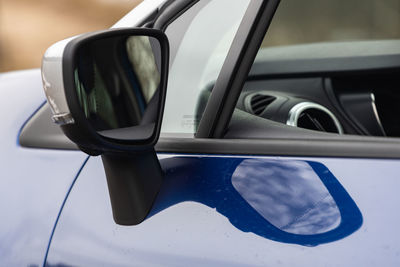 Close-up of car on side-view mirror