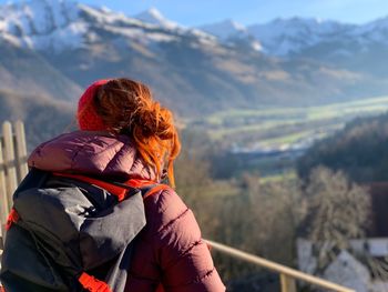 Rear view of woman looking at mountain