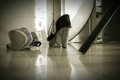 Rear view of woman standing in corridor