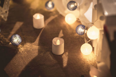 High angle view of illuminated christmas lights on table