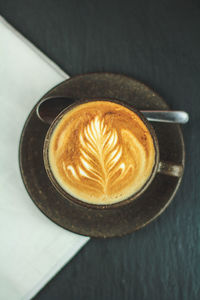 High angle view of cappuccino on table