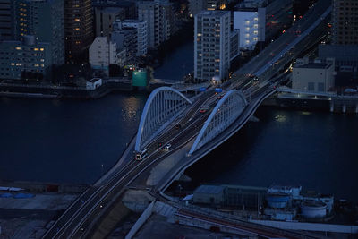 High angle view of bridge over river against buildings