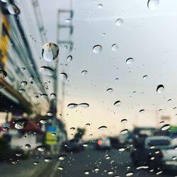 Full frame shot of wet car glass window during rainy season