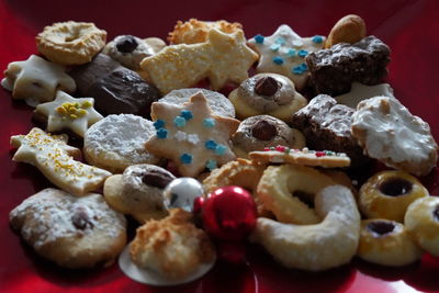 Close-up of christmas cookies on red plate 