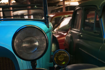 Close-up of vintage cars at garage