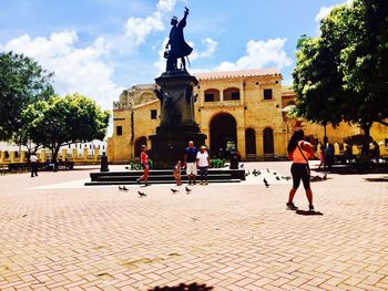 People at town square against sky