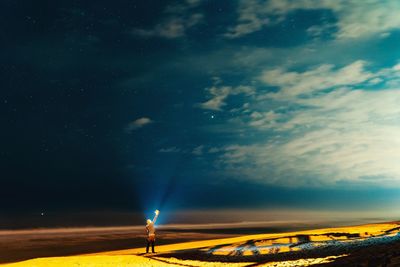 Scenic view of field against sky at night