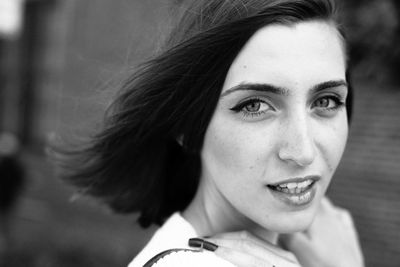 Close-up portrait of a smiling young woman