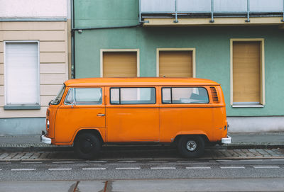 Vintage car on street against building