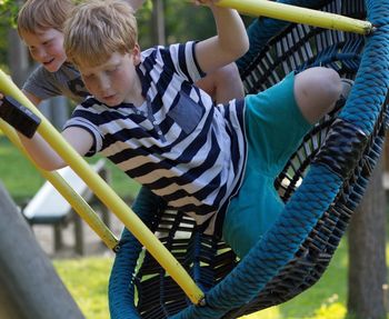 Children playing on slide in playground