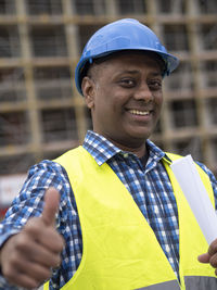 Rear view of man standing against building