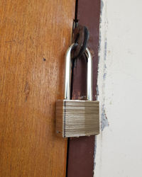 Close-up of padlock on metal door