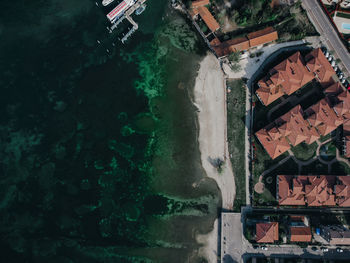 High angle view of buildings by city