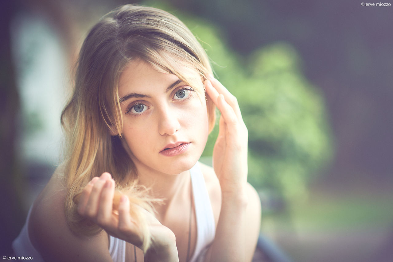 portrait, one person, real people, young adult, headshot, young women, focus on foreground, lifestyles, hair, looking at camera, blond hair, beauty, beautiful woman, front view, day, women, close-up, selective focus, hairstyle, contemplation