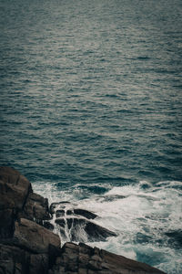 High angle view of rocks in sea