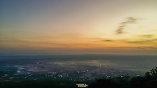 High angle view of buildings against sky during sunset