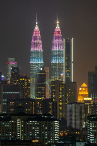 Illuminated buildings in city at night