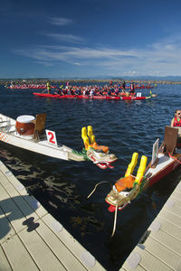 Boats in sea against sky