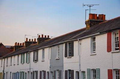 Houses against sky in city