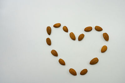 High angle view of heart shape over white background