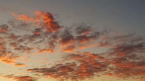 Low angle view of dramatic sky during sunset