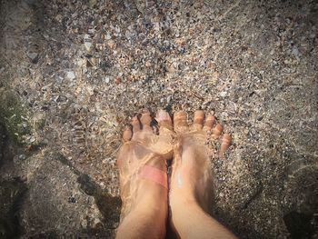 Low section of woman in water