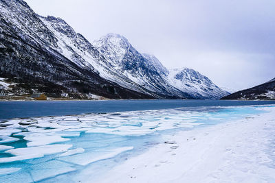 Scenic view of frozen lake against sky