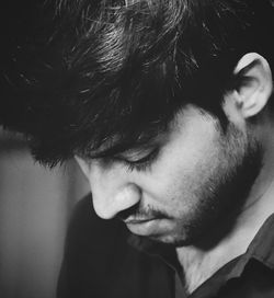 Close-up portrait of young man looking away