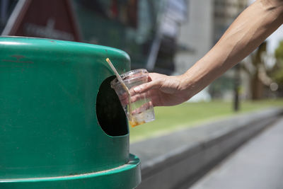 Close-up of hand holding drink