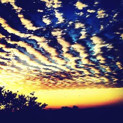 Scenic view of dramatic sky at sunset