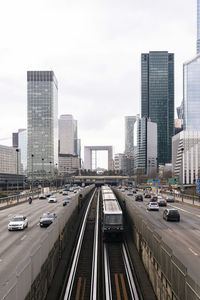 France, ile-de-france, paris, city traffic with skyscrapers of la defense district in background