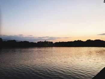 Scenic view of lake against sky during sunset