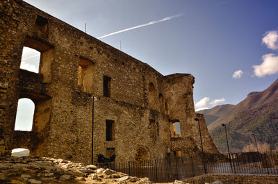 Low angle view of old building against sky