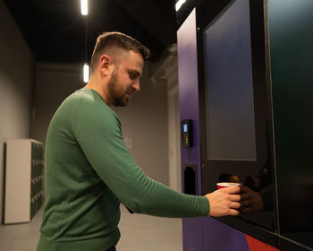 Side view of man working at home