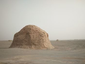 Rock formation in desert against clear sky