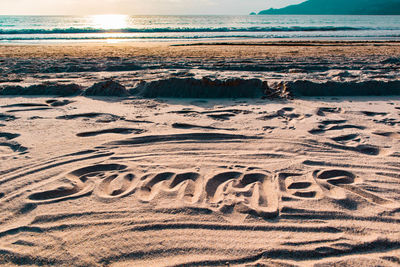 Scenic view of beach against sky during sunset