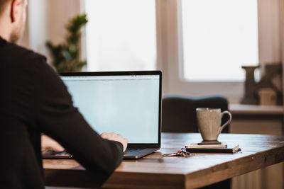 Close-up of man working on table