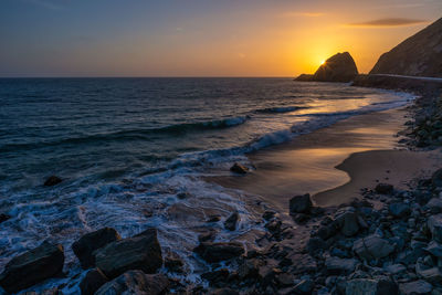 Scenic view of sea against sky during sunset