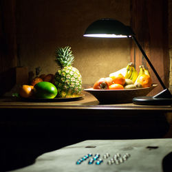 Various fruits in bowl on table