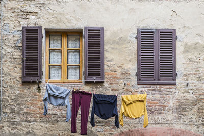 Laundry hanging outside to dry in florence / tuscany