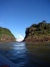 Scenic view of sea against clear blue sky