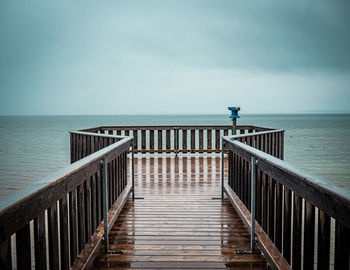 Pier over sea against sky