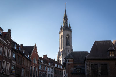 Low angle view of buildings in city against sky