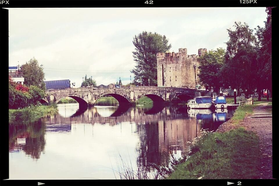 transfer print, built structure, architecture, auto post production filter, sky, tree, water, building exterior, connection, river, bridge - man made structure, cloud - sky, reflection, waterfront, canal, bridge, cloud, lake, day, outdoors